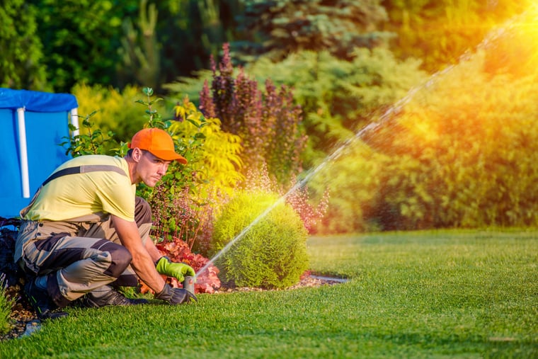 sprinkler-system-repair-irrigation-crew-member