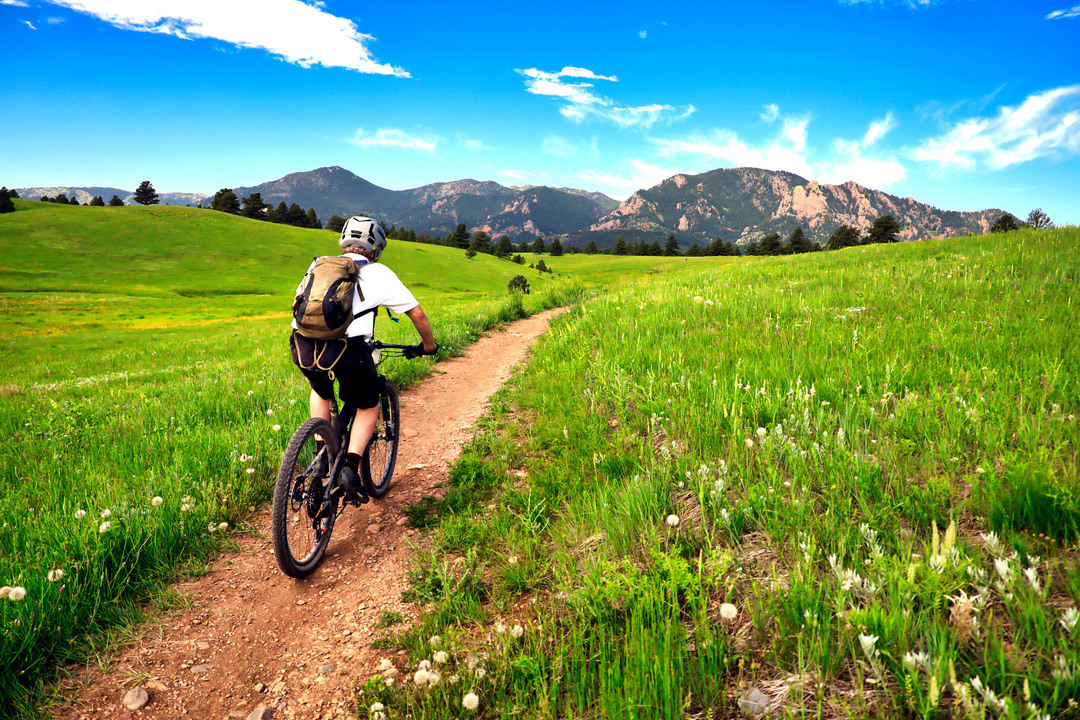 mountain biker rides near boulder colorado