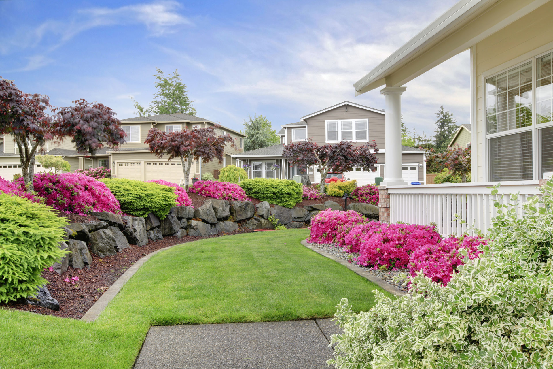 Beautiful lawn with flowers in a residential neighborhood